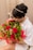 A happy customer receiving a luxurious flower delivery.