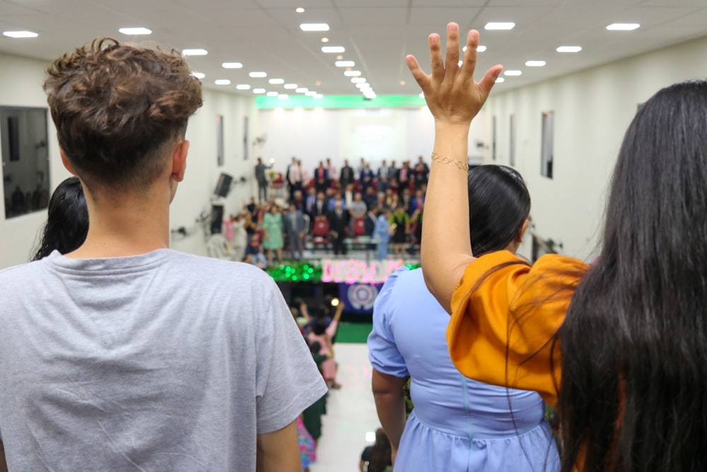 a group of people standing in front of a crowd