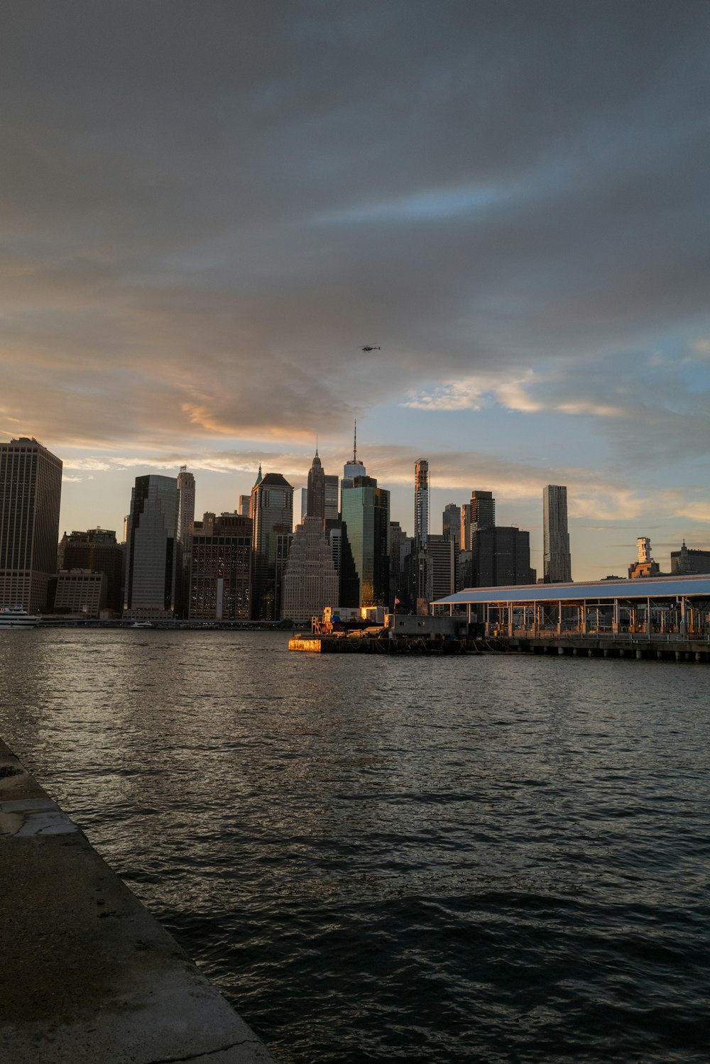 a large body of water with a city in the background