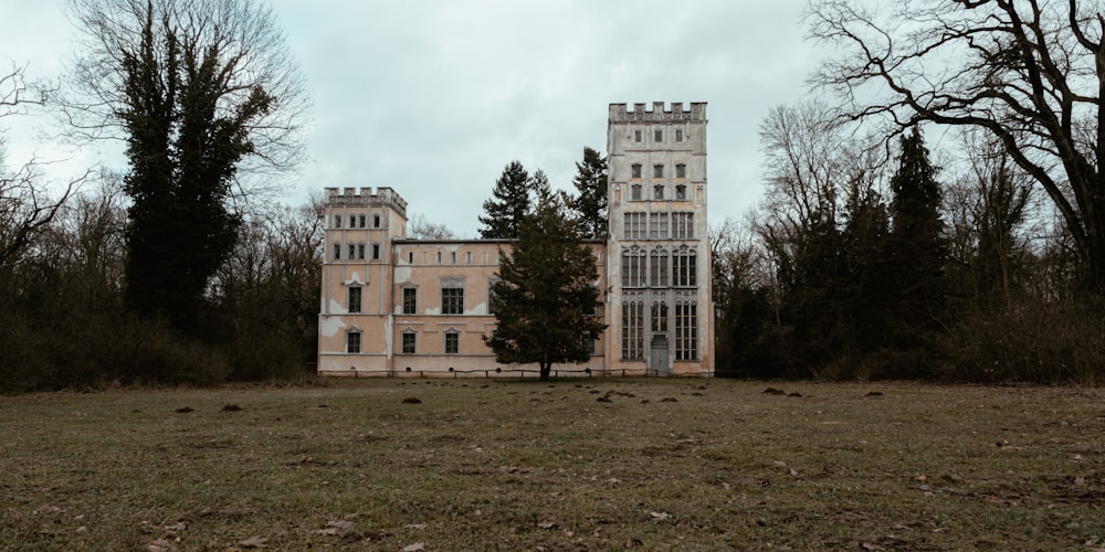 a large building sitting in the middle of a field