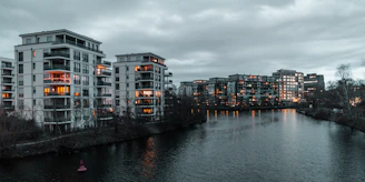 Cozy exterior view of the apartment near the Una river at sunset.