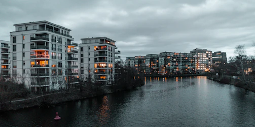 Cozy exterior view of the apartment near the Una river at sunset.
