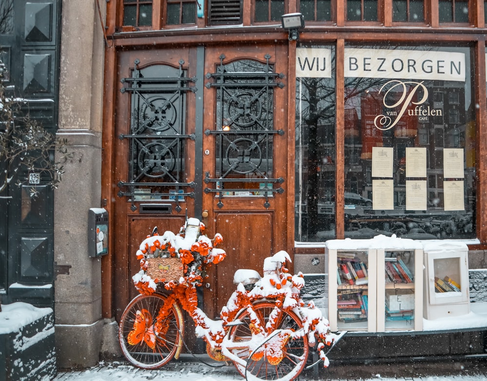 a couple of bikes parked in front of a building