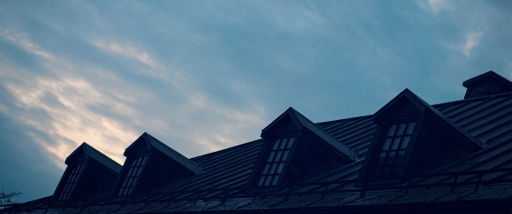 the roof of a building with a clock on it