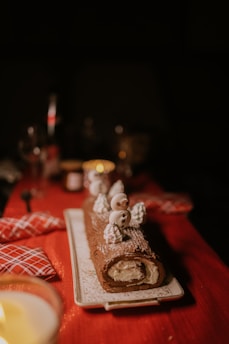 a table topped with a plate of food and a candle