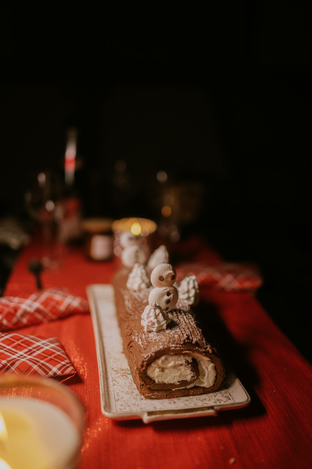 a table topped with a plate of food and a candle