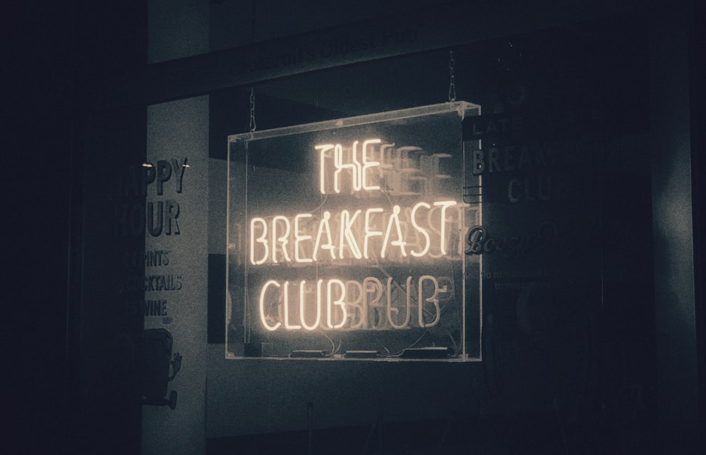 a neon sign that reads the breakfast club