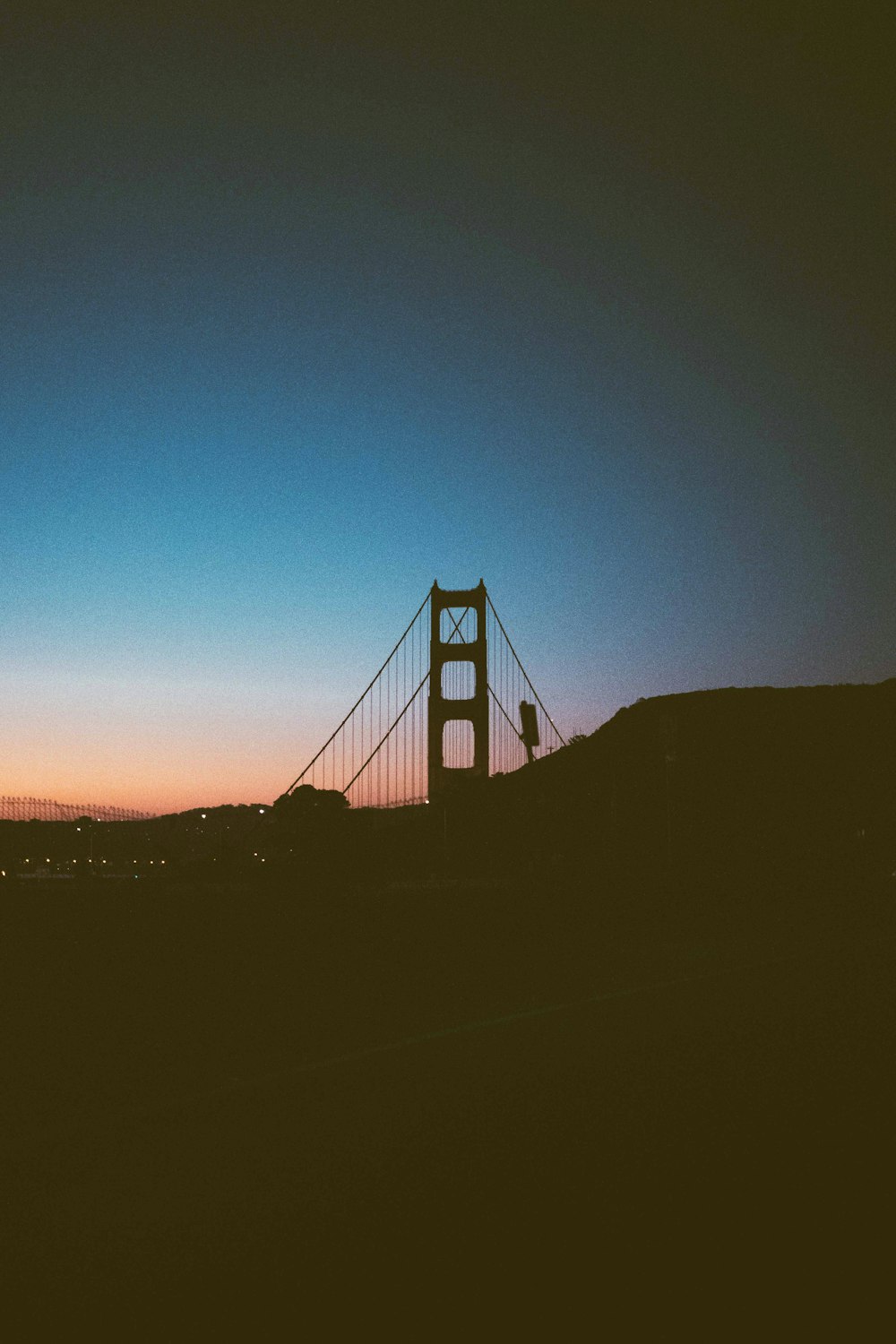 a view of the golden gate bridge at sunset