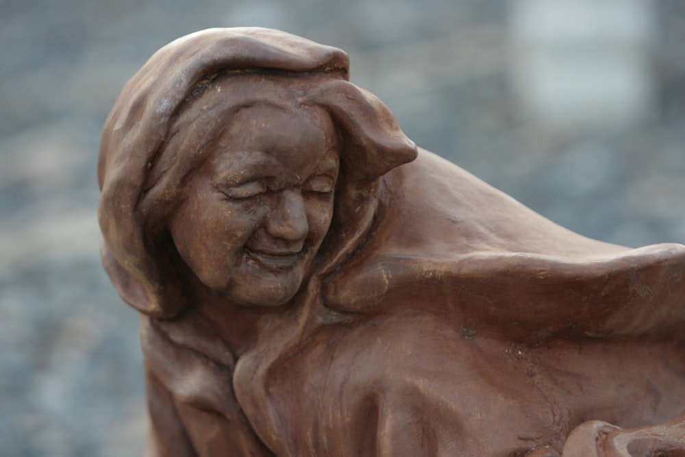 a statue of a woman with her eyes closed