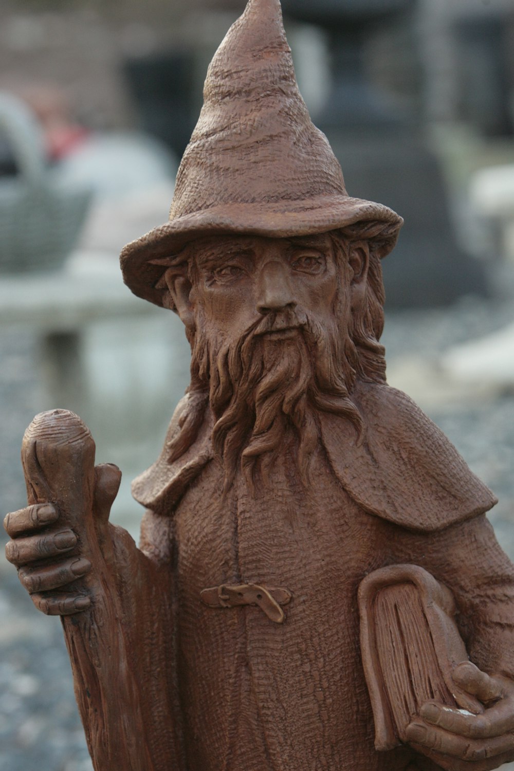 a statue of a man with a hat and a cane