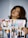 A person with dark hair and makeup is holding a magazine featuring a collage of people and articles titled 'Celebrating the '80s'. The magazine includes various images and colors, which evoke a retro theme.