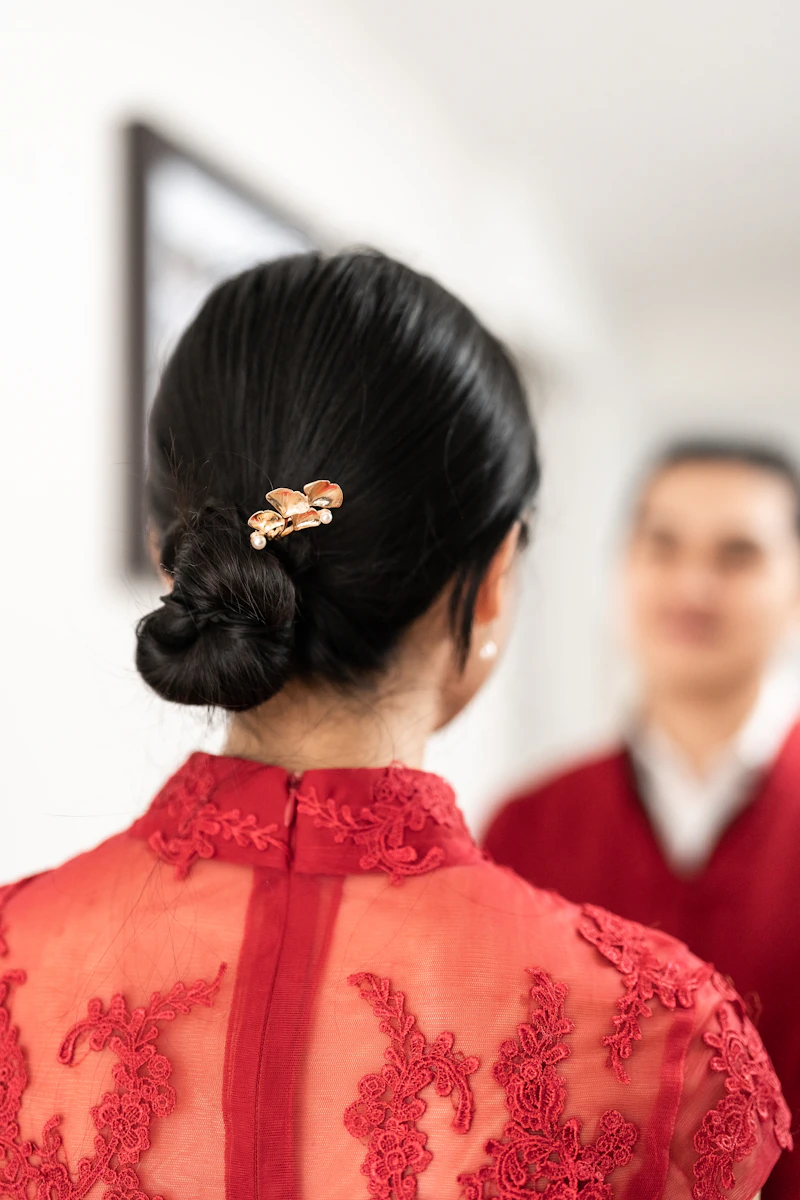 Bride in red dress with flower in her hair