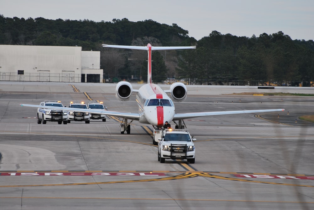 a large jetliner sitting on top of an airport runway