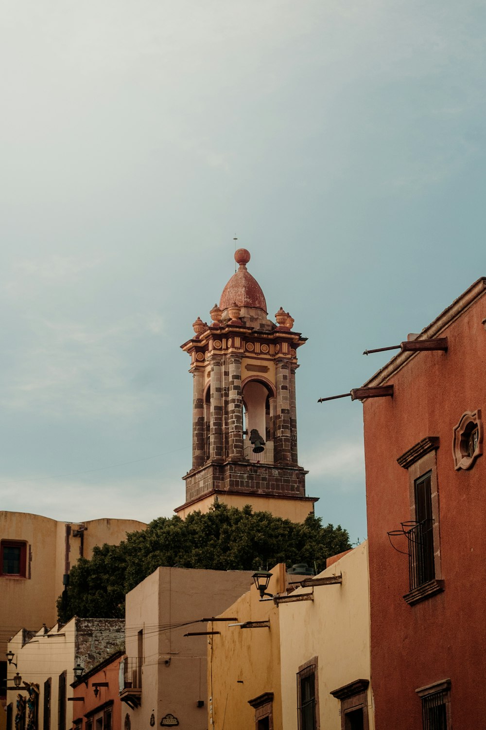 a tall clock tower towering over a city