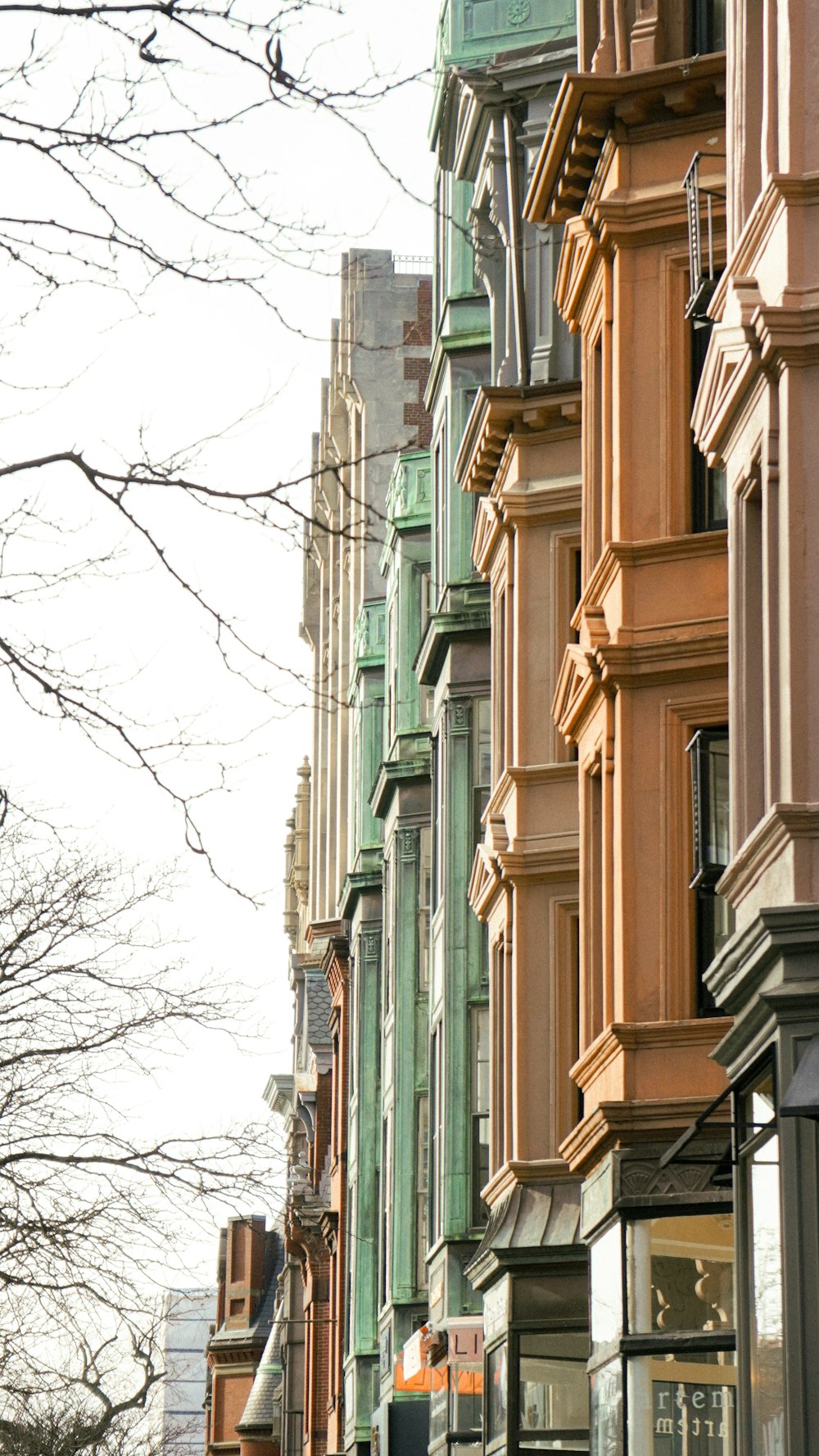 a row of buildings on a city street