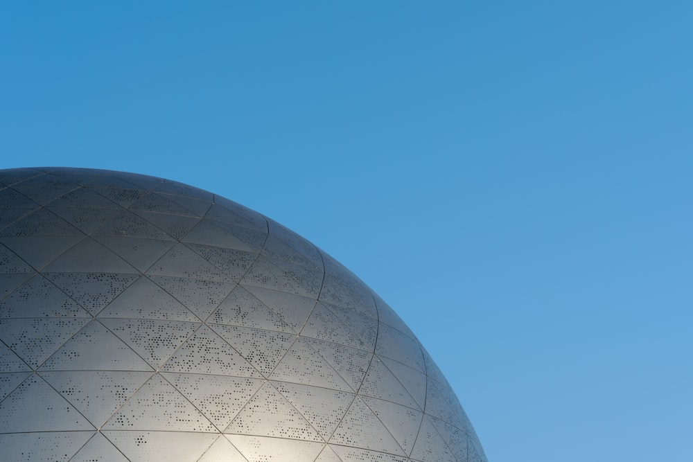 a close up of a building with a blue sky in the background