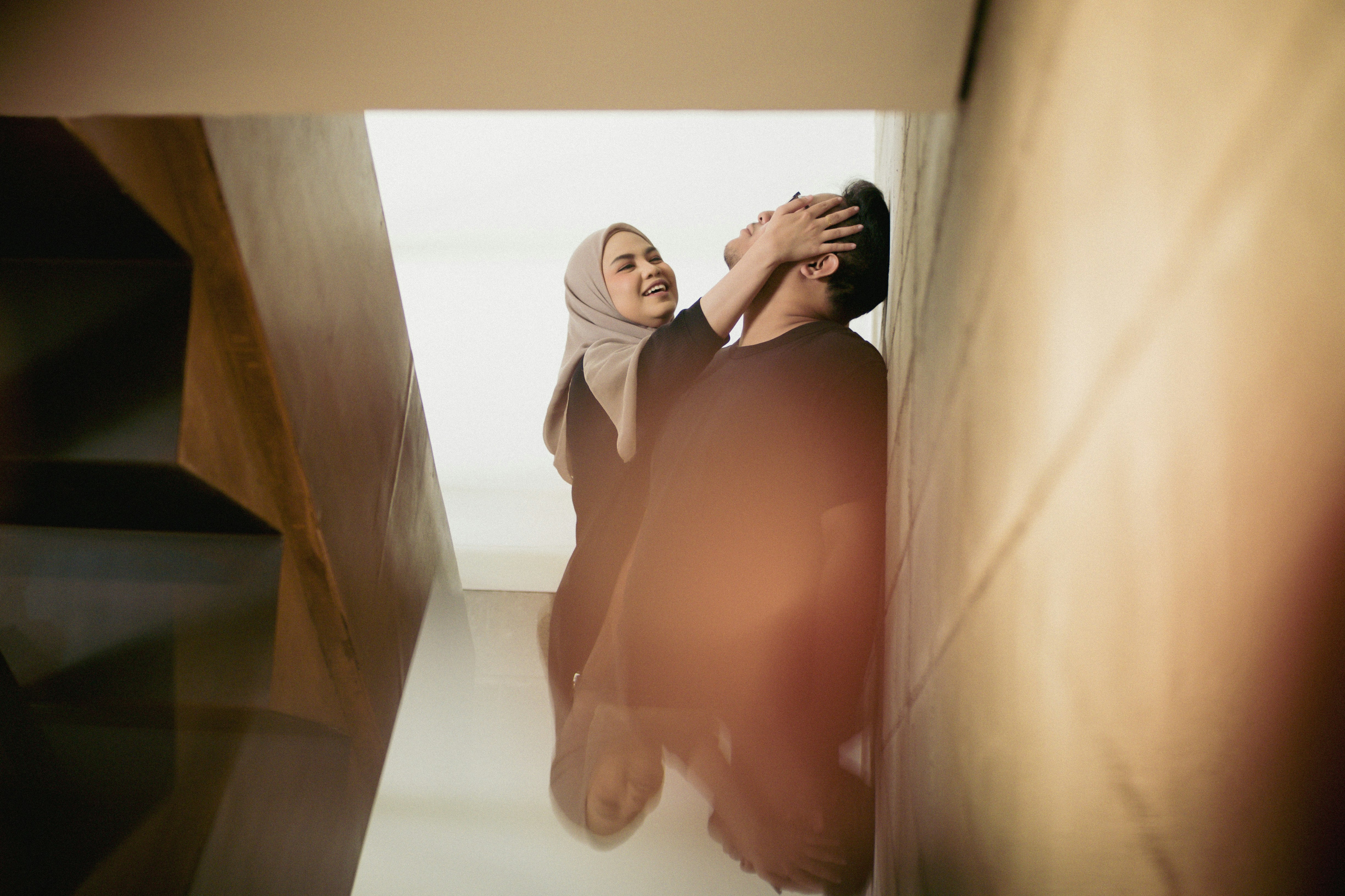 A man and a woman standing next to each other