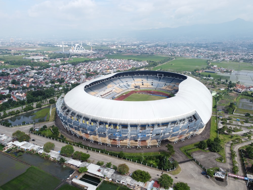 an aerial view of a soccer stadium in a city