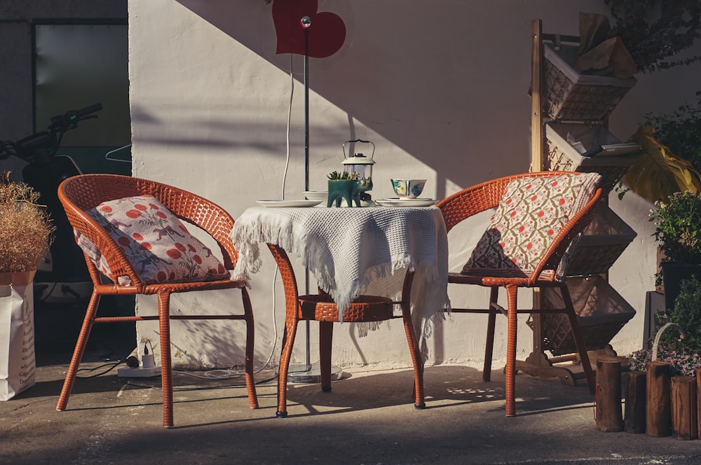 a couple of chairs sitting next to a table