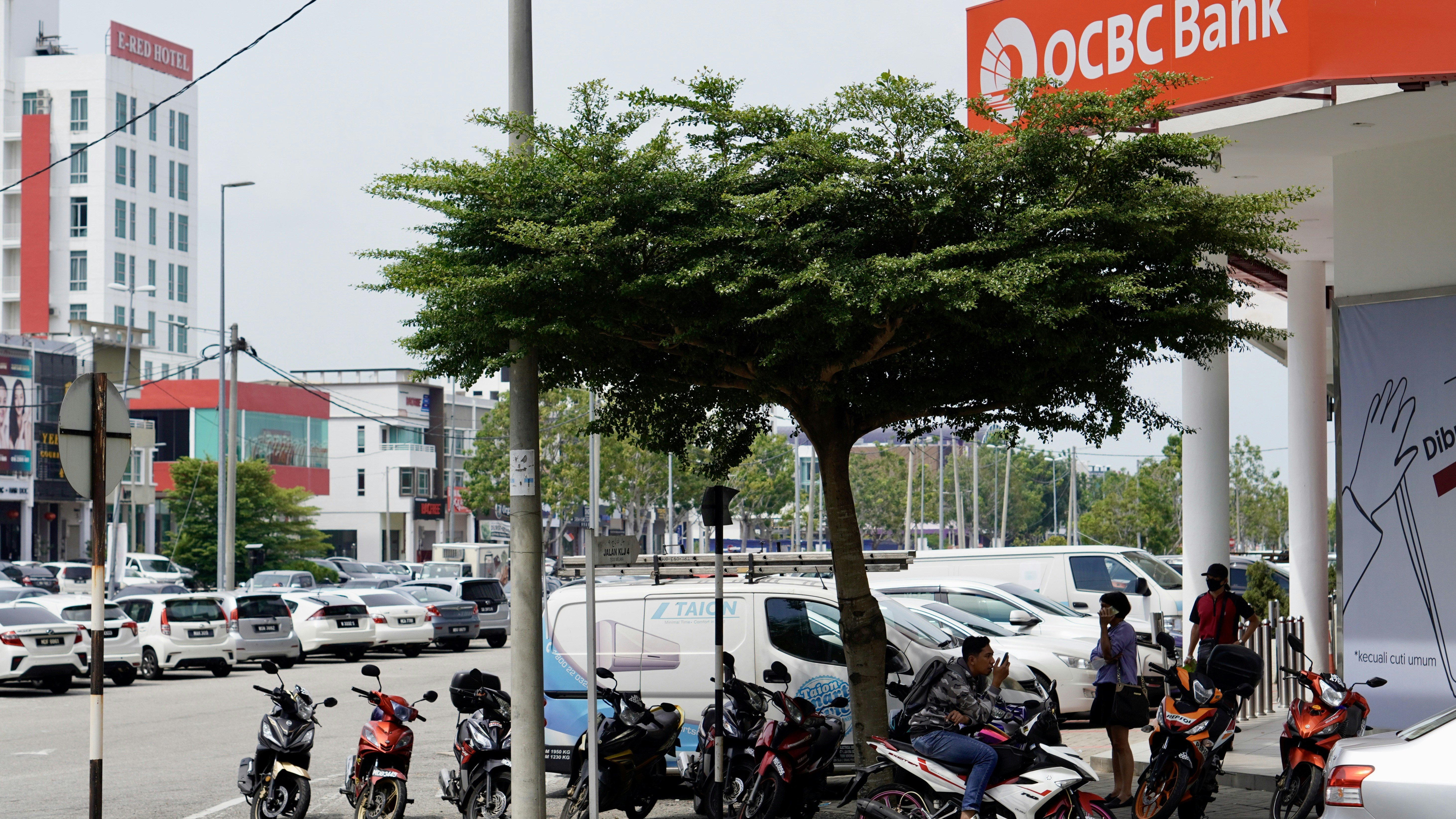 a group of motorcycles parked on the side of a road