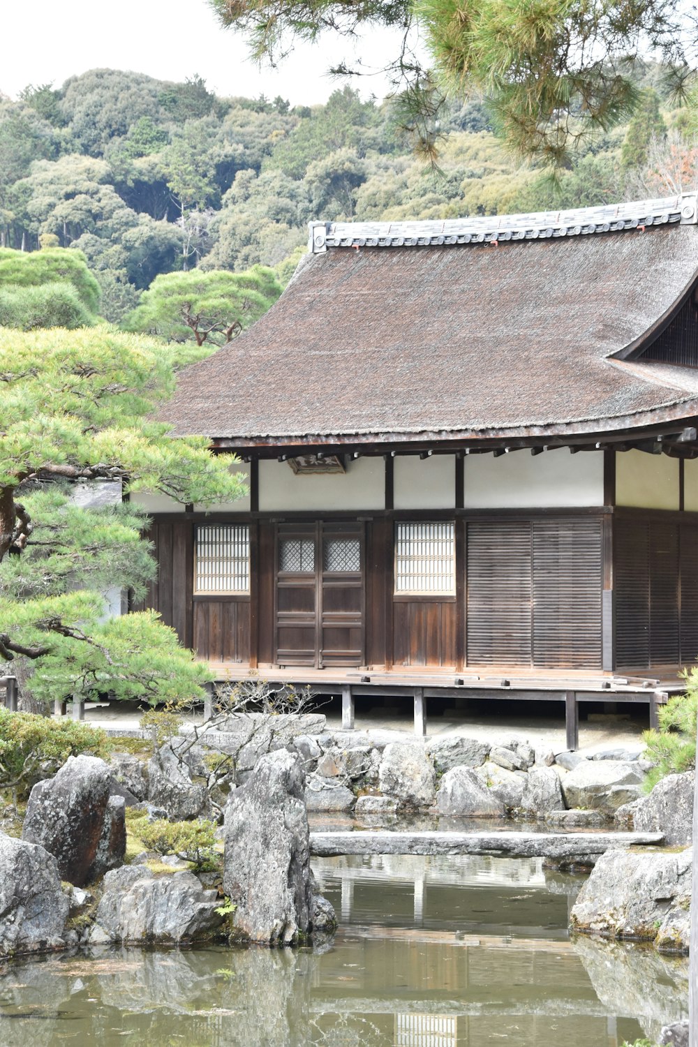 a building with a pond in front of it