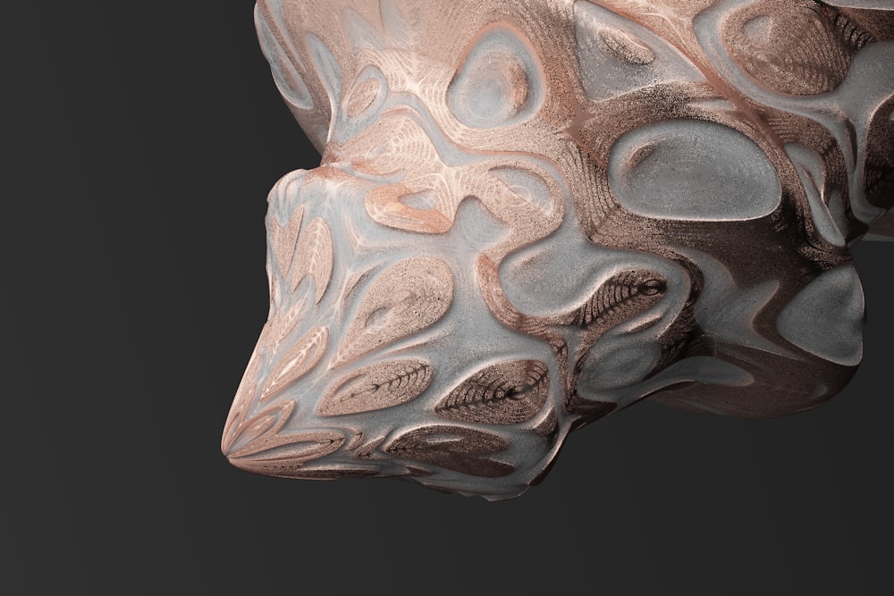 a close up of a sculpture of a dog's head