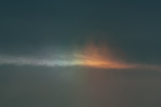 A serene sky with soft light breaking through clouds symbolizing divine guidance.