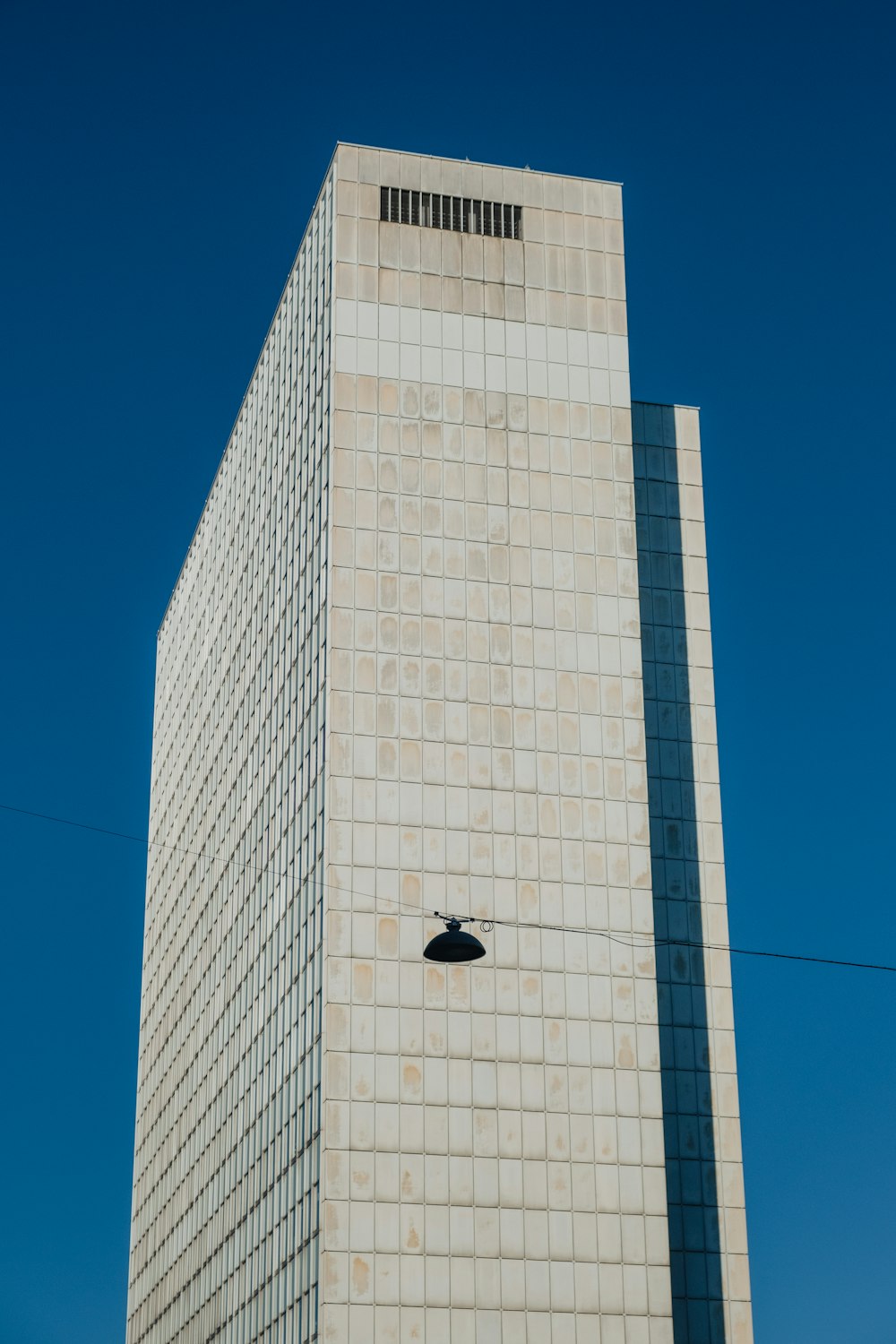 a tall building with a clock on the side of it