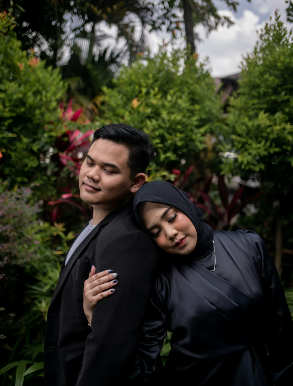 a man and a woman standing next to each other