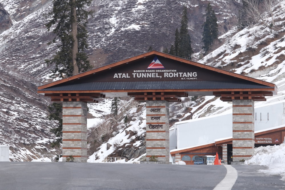 the entrance to the hotel at the foot of a snowy mountain