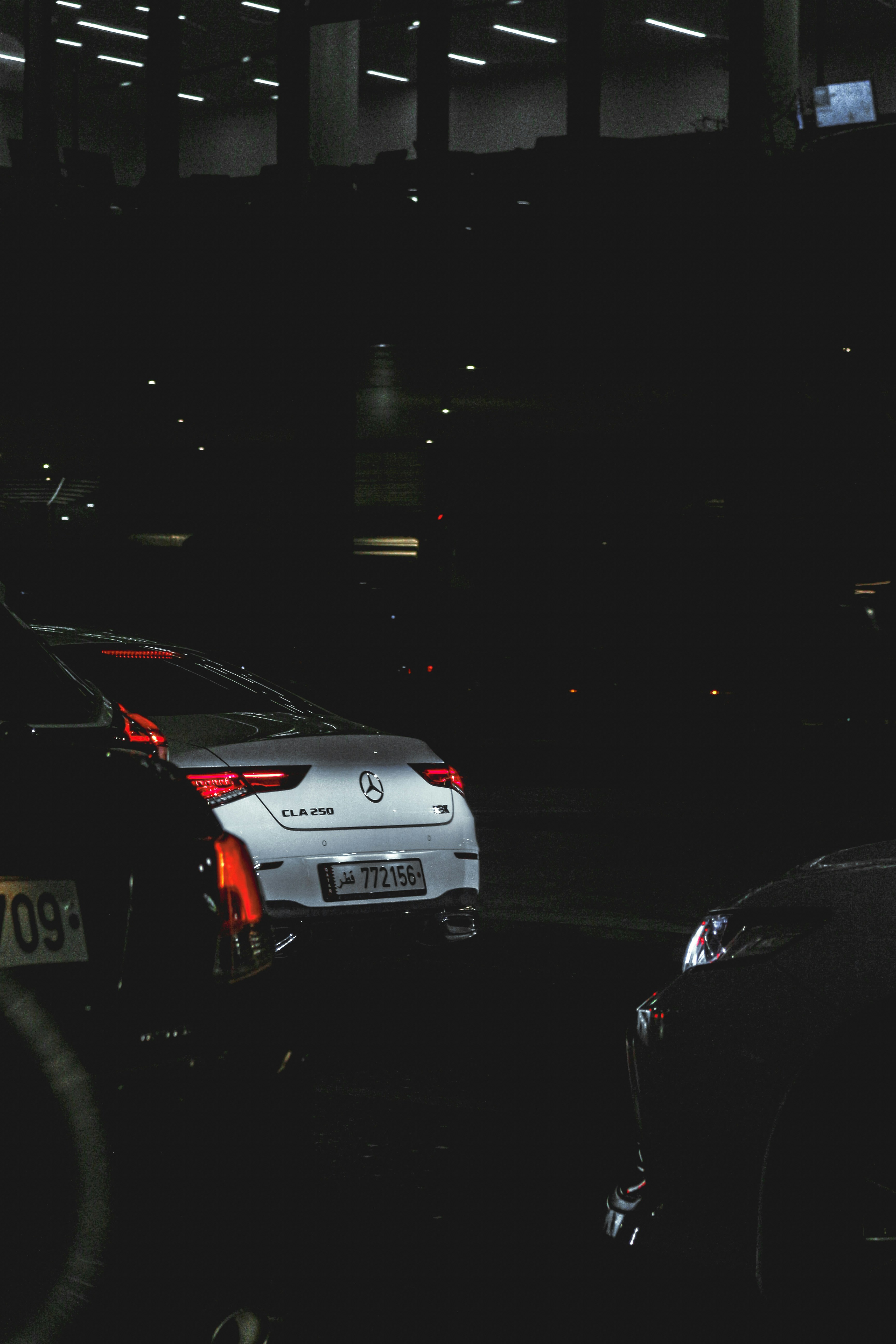 a group of cars parked next to each other in a parking lot