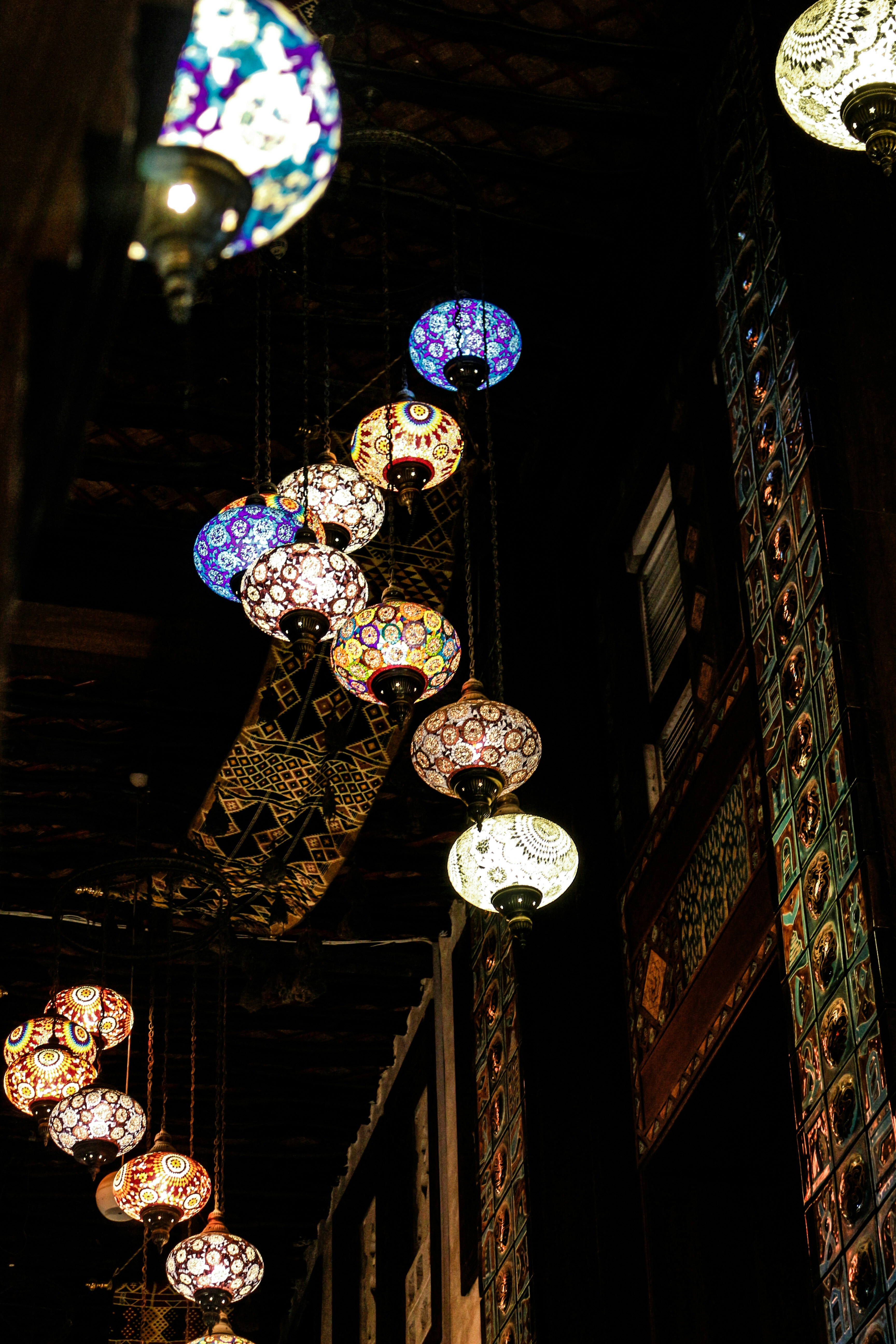 A number of lights hanging from a ceiling photo Free Qatar Image on