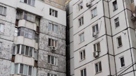 Before and after comparison of a community building's energy-efficient rehabilitation.