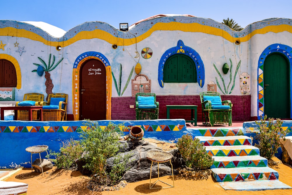 a colorfully painted building with steps leading up to it