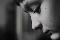 a black and white photo of a young man