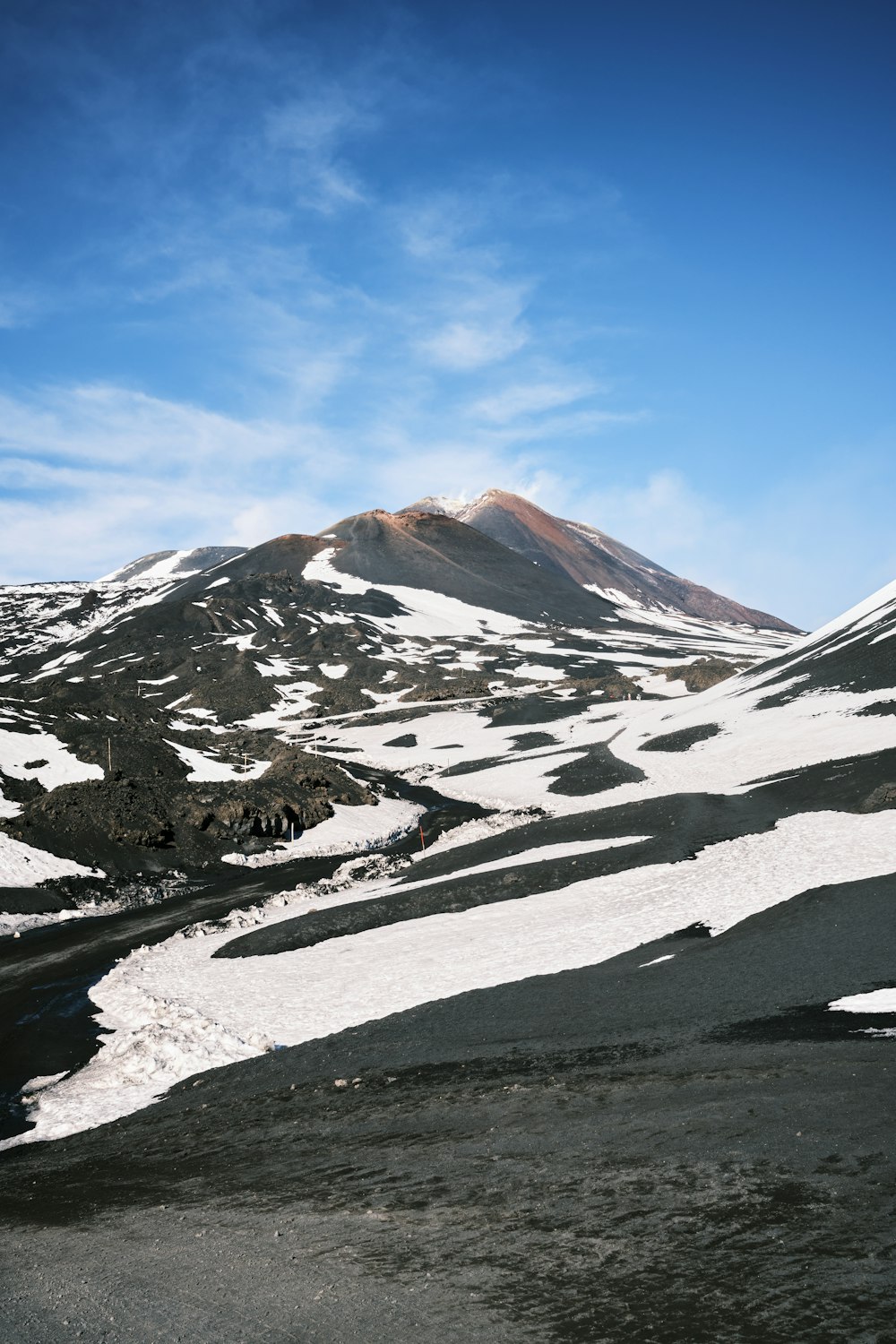 a mountain covered in snow under a blue sky