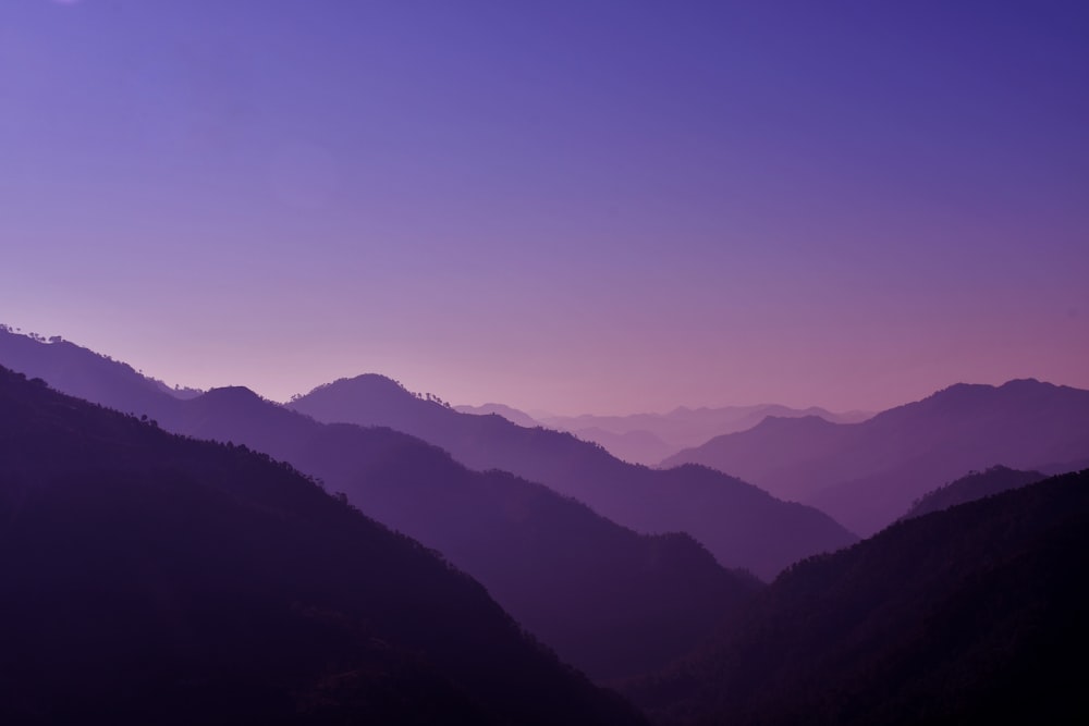 a view of a mountain range at sunset