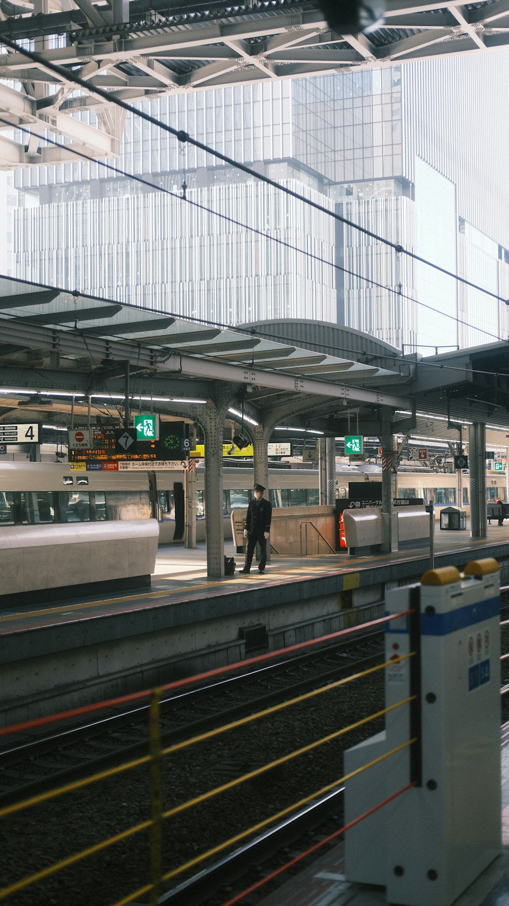 a train station with a train pulling into the station