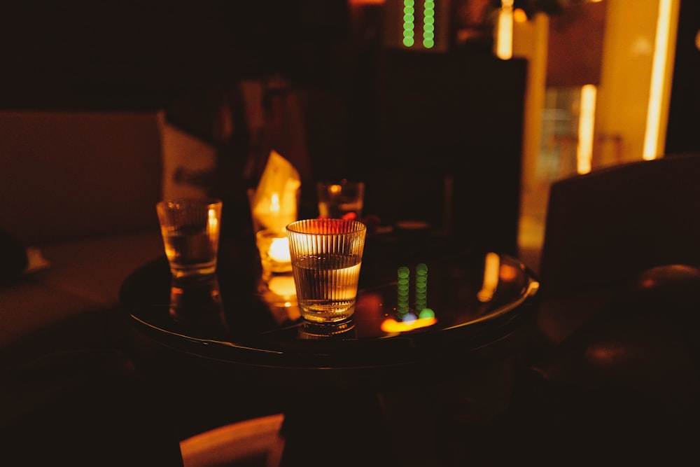 two shot glasses sitting on top of a table