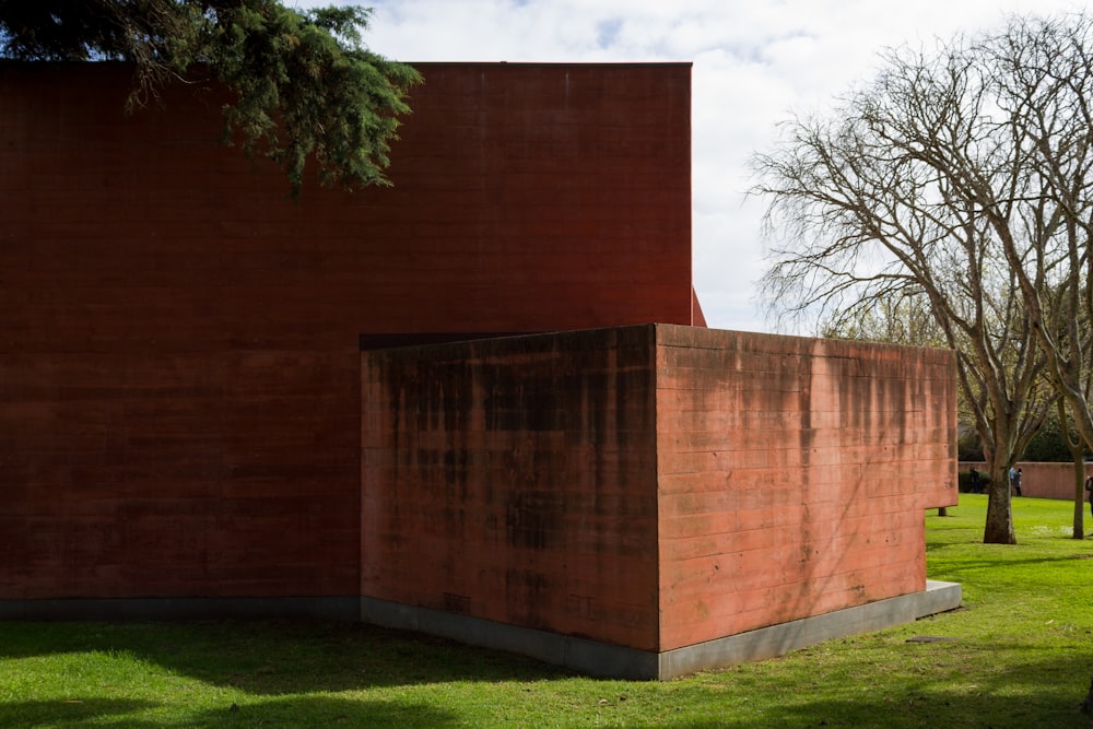 a large brick structure sitting in the middle of a park