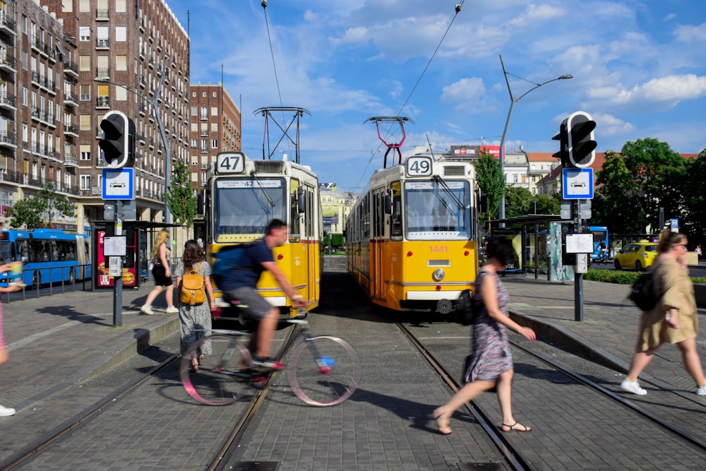 a group of people walking and riding bikes on a street