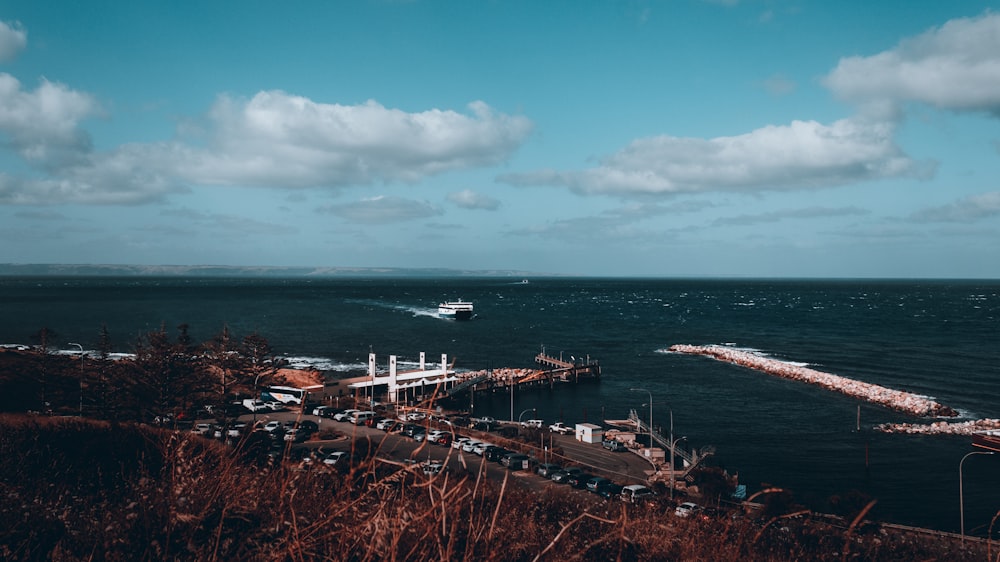 a boat is in the water near a pier