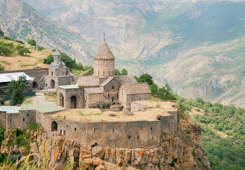an old church perched on top of a cliff