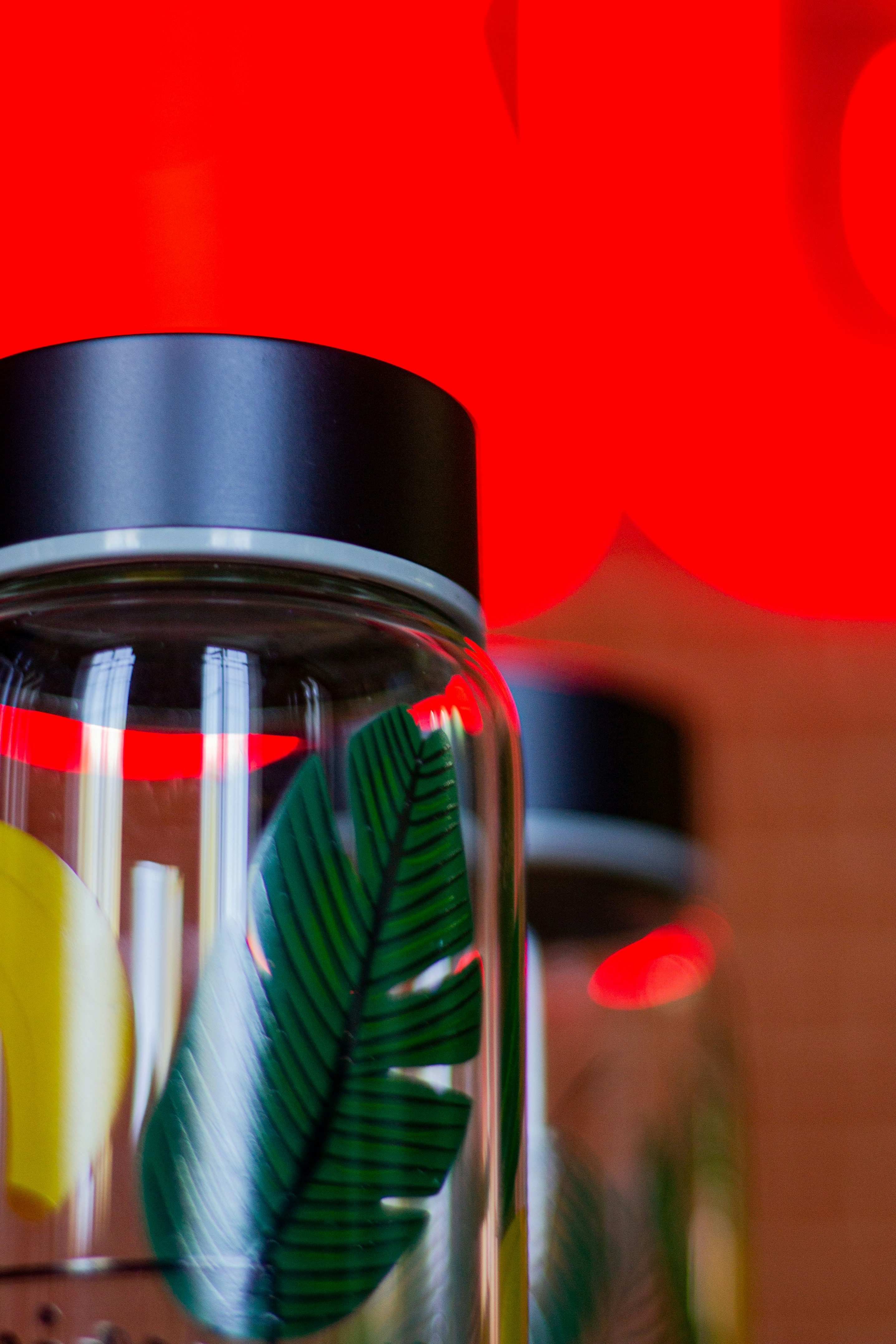 a glass jar filled with different types of fruit