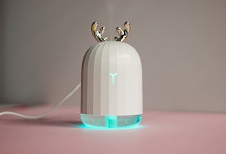 an electronic device with two birds on top of it