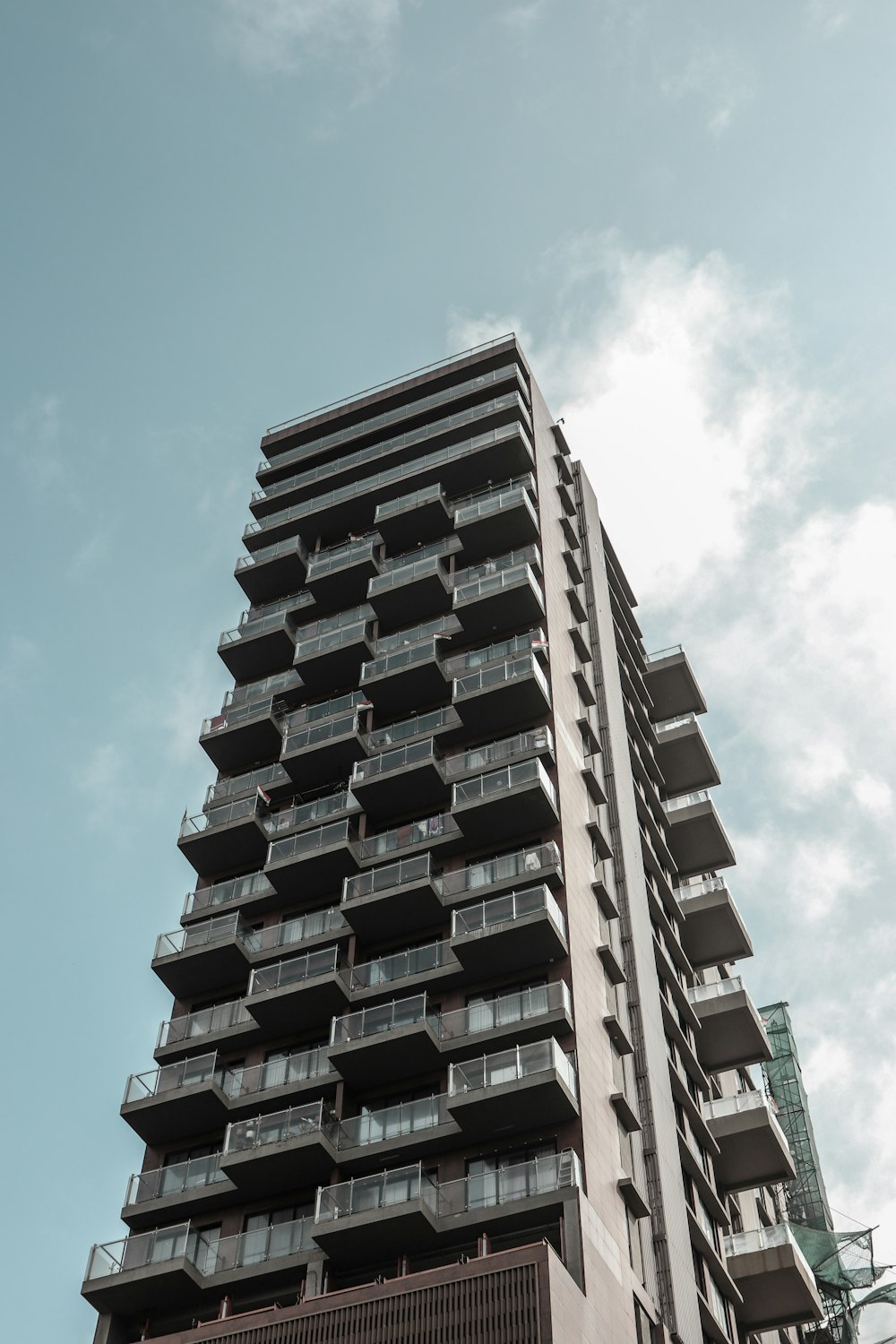 a tall building with balconies and balconies on it