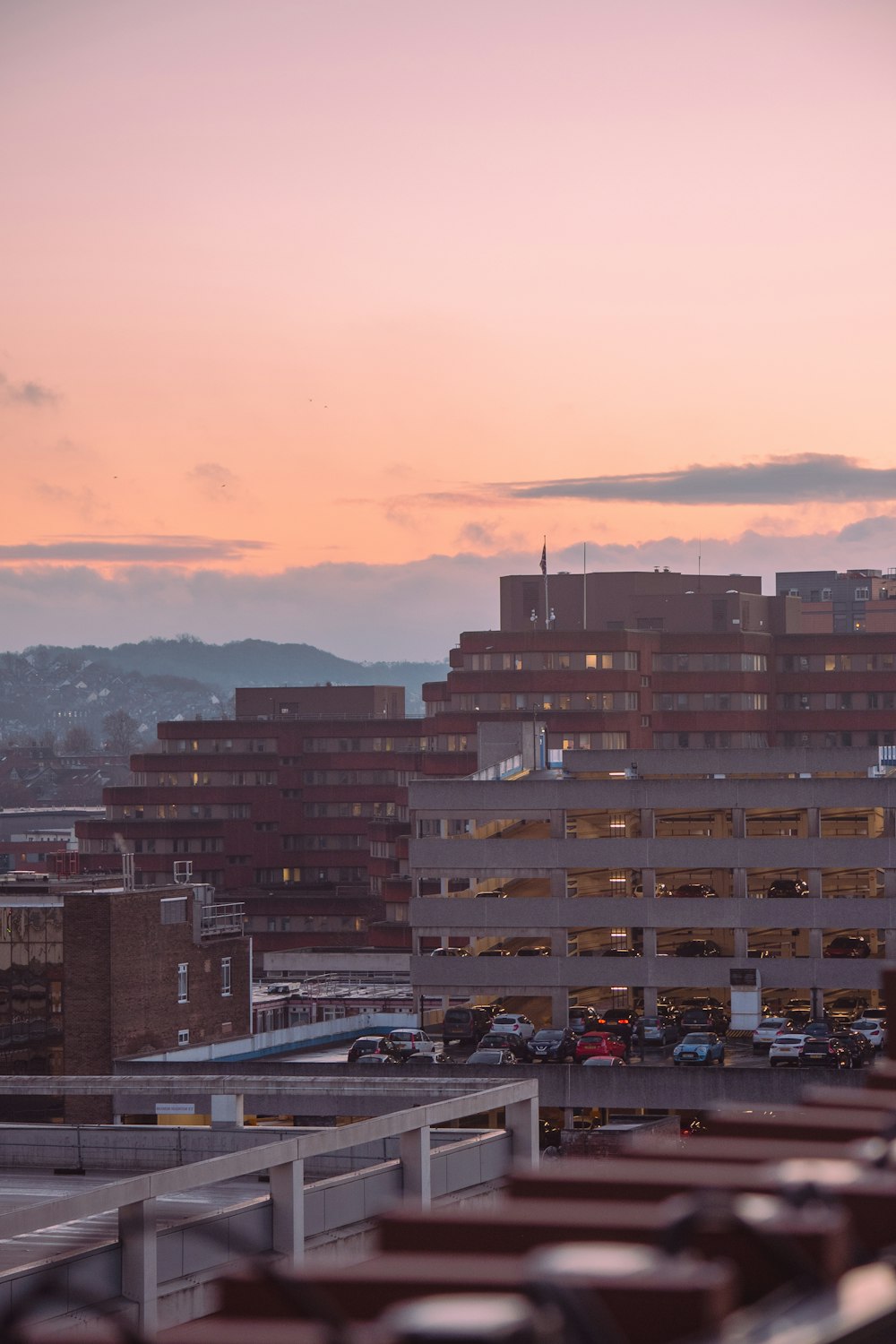 a view of a parking lot with a building in the background