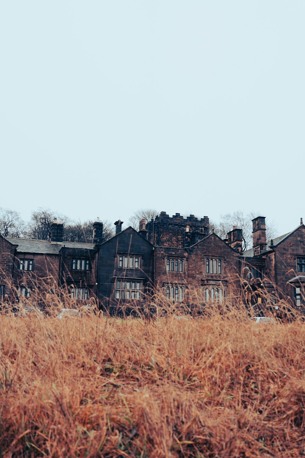 a large building sitting in the middle of a field