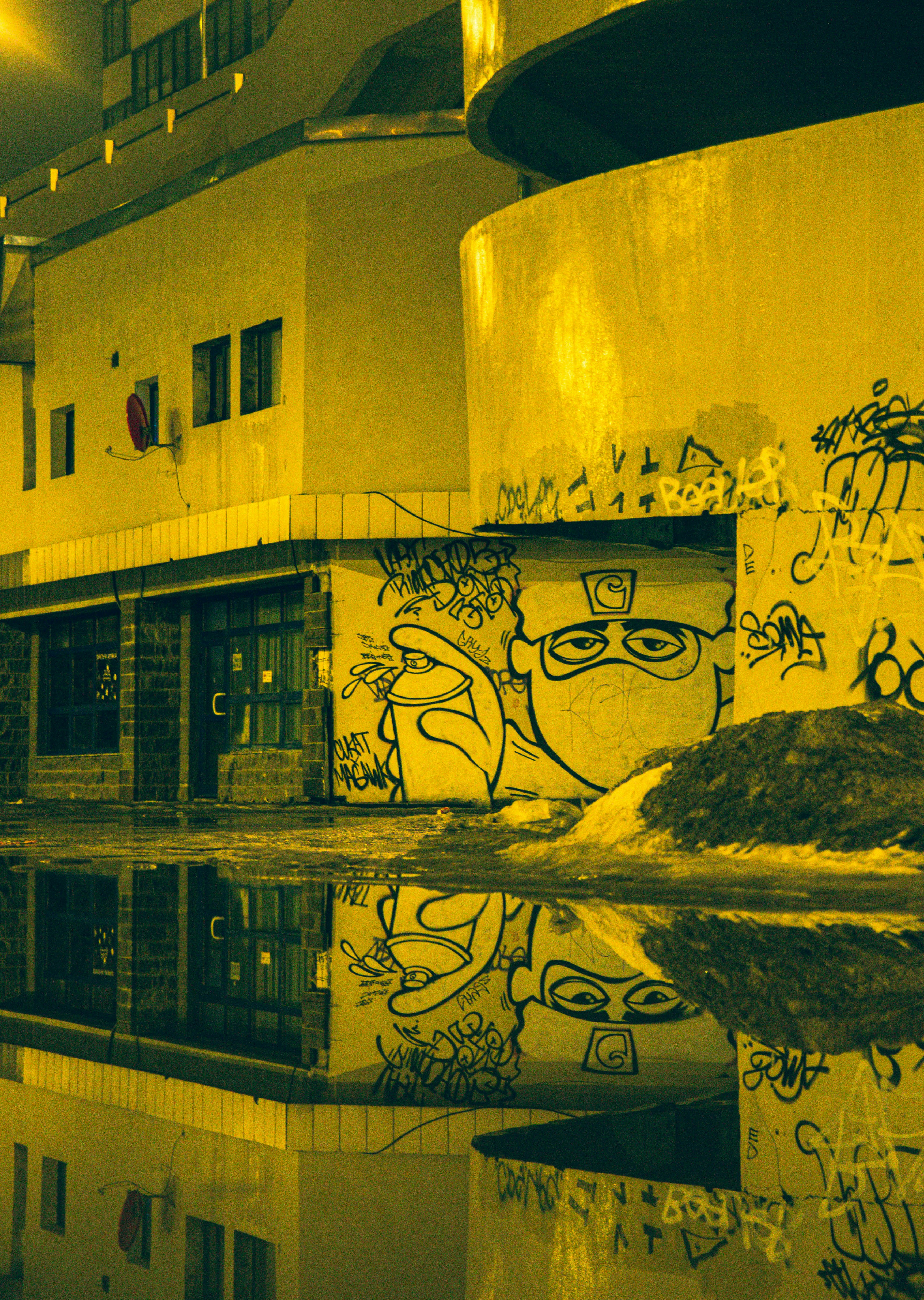 a reflection of a building in a pool of water