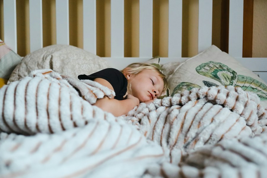 Child reading a book in bed during a calm bedtime routine